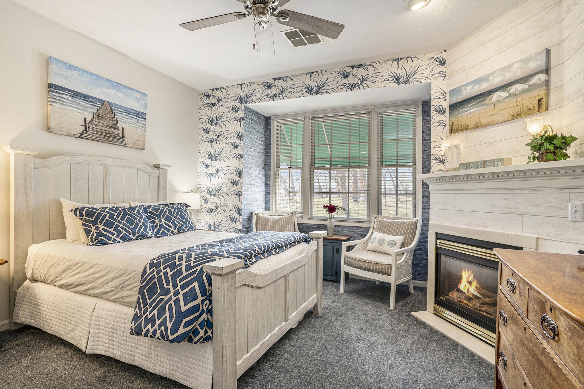 view of queen bed headboard- blue motif
