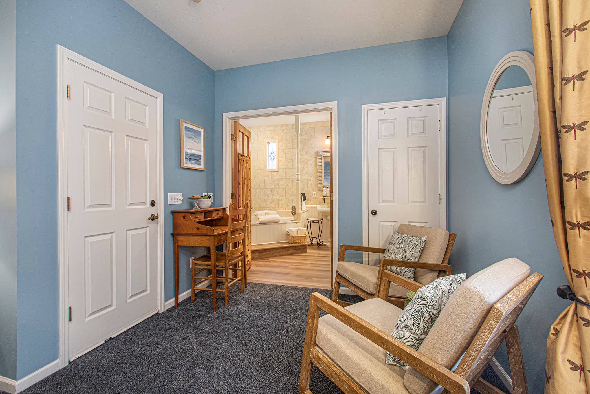 king bed sitting area fireplace and tv