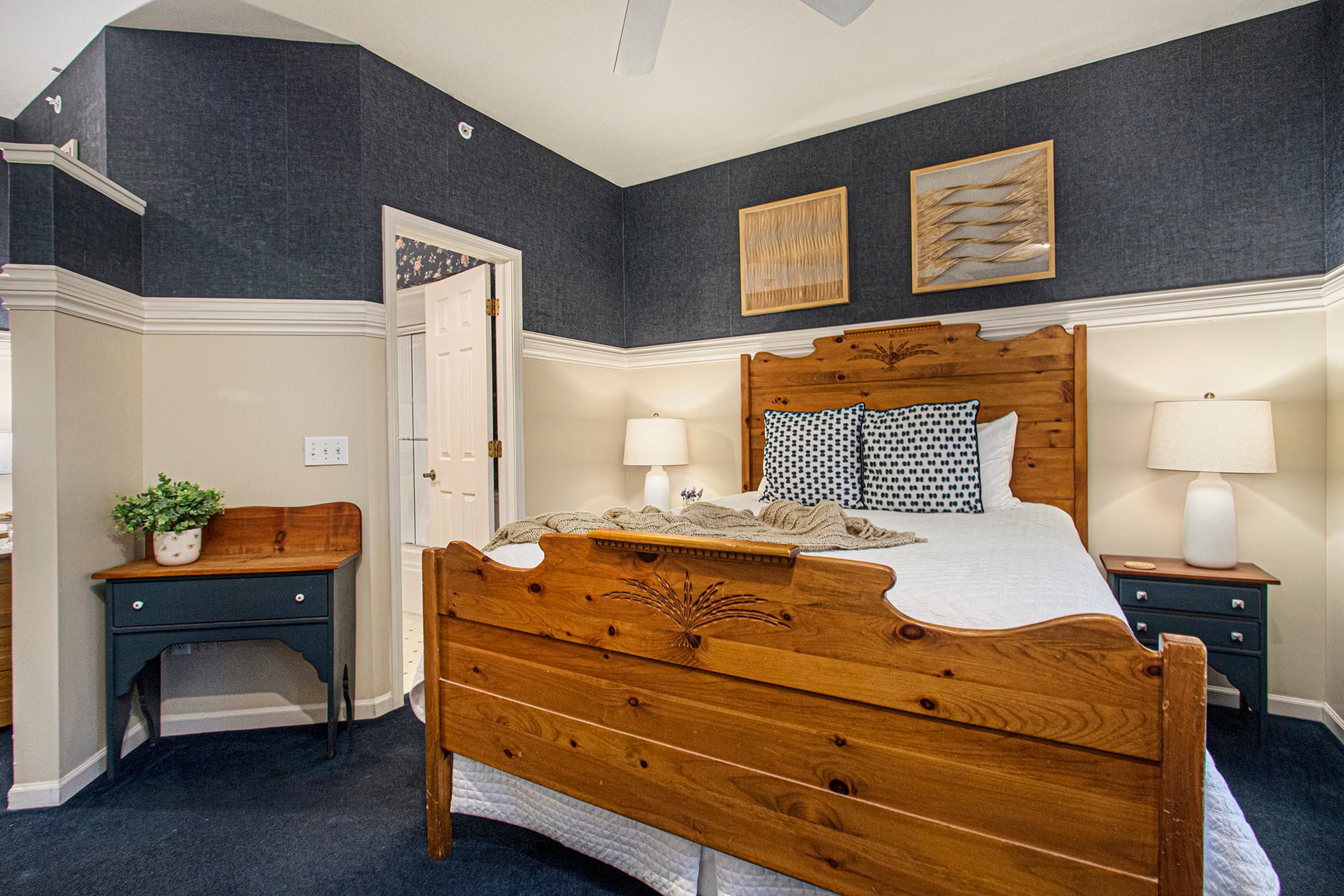 queen bed and bathroom entrance