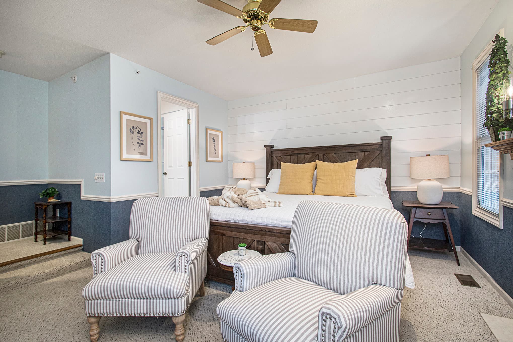 king bed two chairs and bath entrance