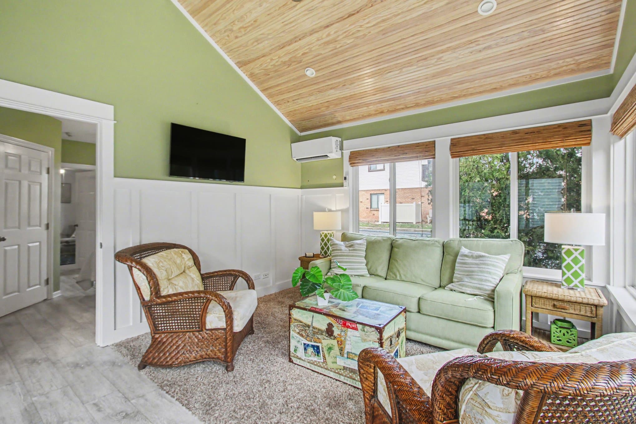 3 season porch with seating and TV