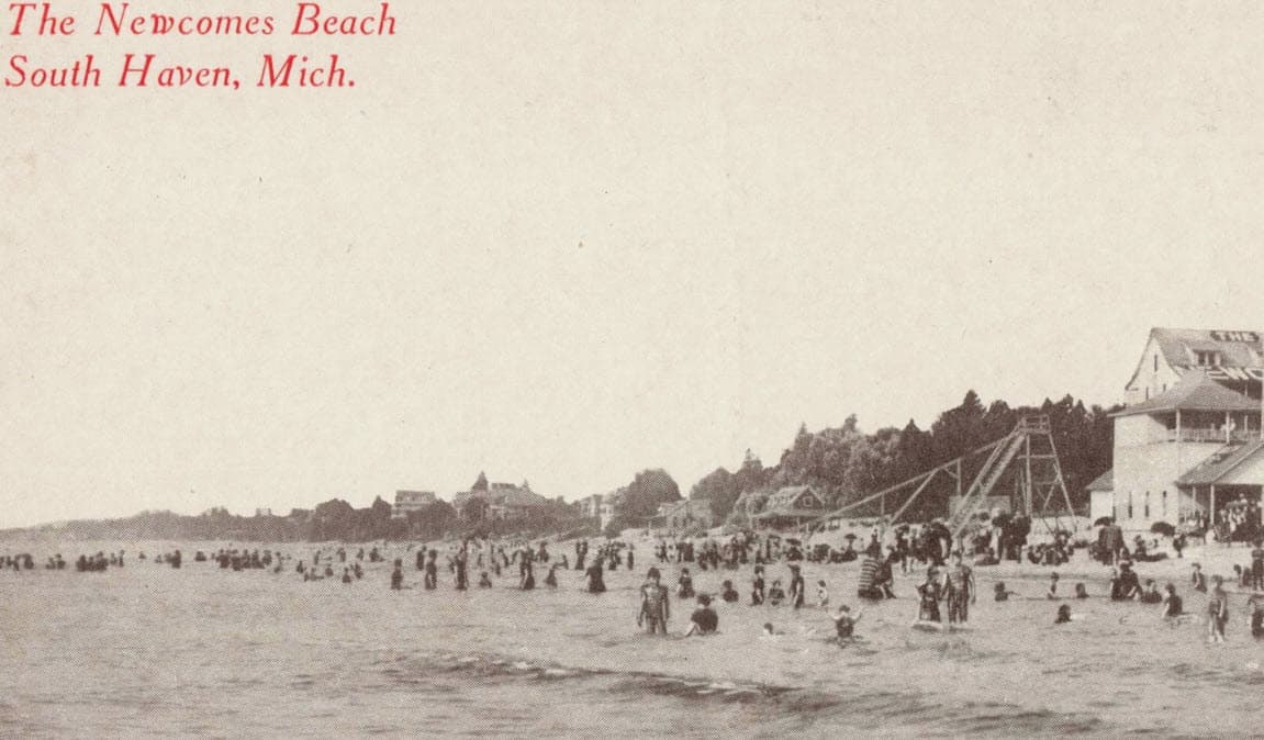 A vintage scene of Newcomes Beach in South Haven, Michigan, filled with people enjoying the water and a beachside building. A vintage scene of Newcomes Beach in South Haven, Michigan, filled with people enjoying the water and a beachside building.