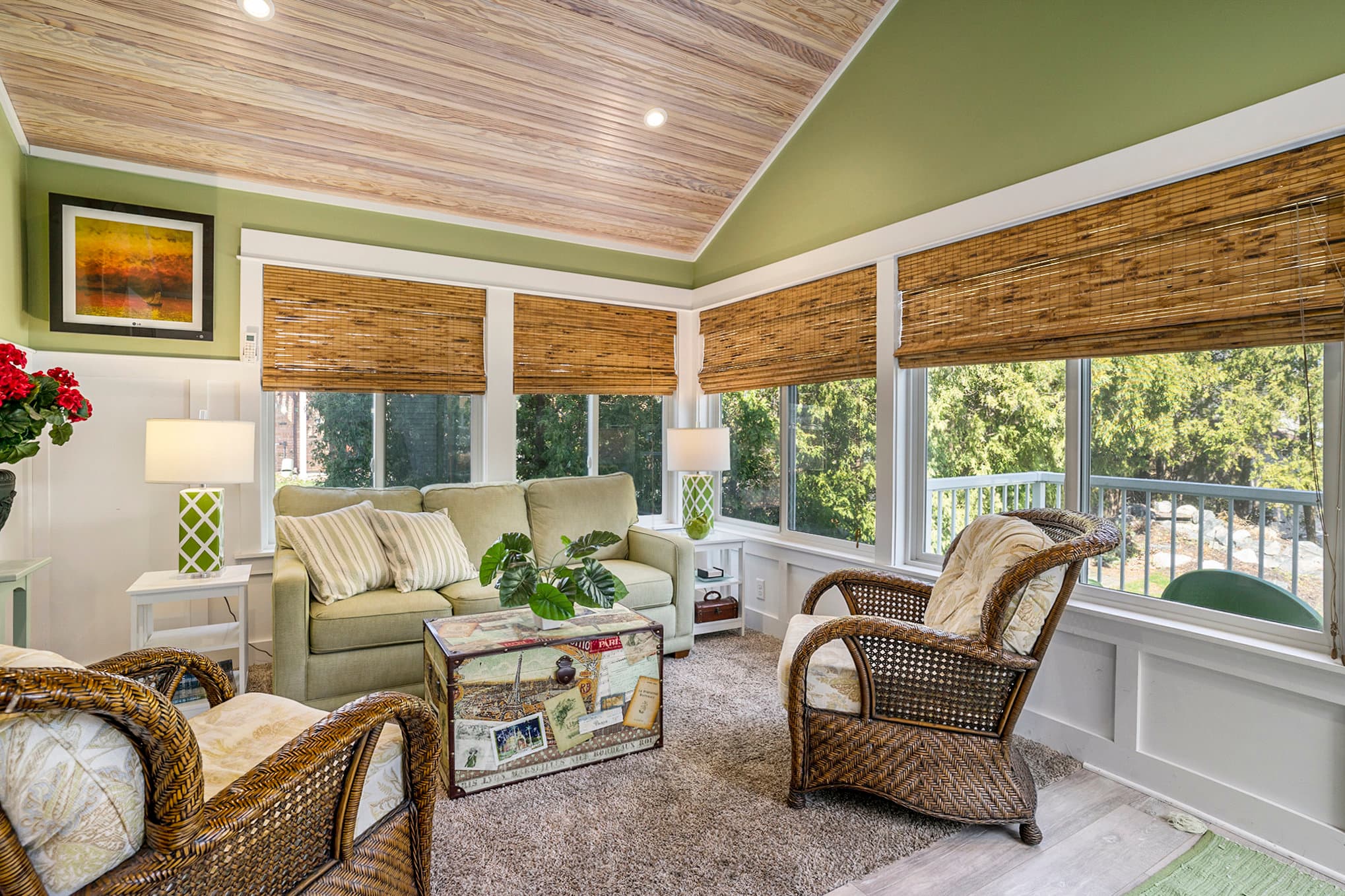 3 season porch with green sofa